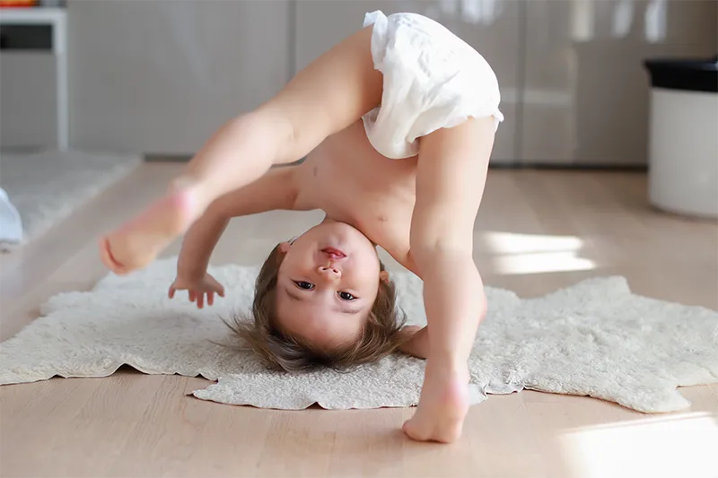 young boy doing handstand